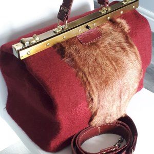 Handmade, one of a kind, felted purse with a doctor’s bag frame.